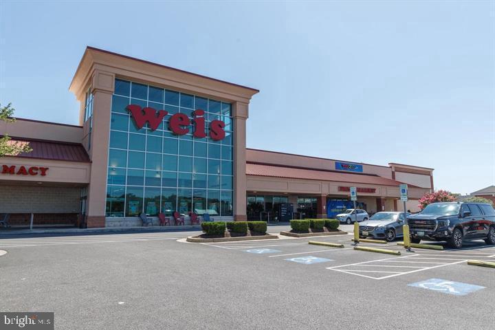 13 Brook Farm Court, Unit 13L Perry Hall, MD 21128 - Photo 28 of 31 a car parked in front of a building