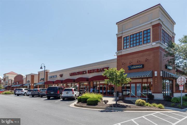 13 Brook Farm Court, Unit 13L Perry Hall, MD 21128 - Photo 29 of 31 a group of cars parked in front of a building