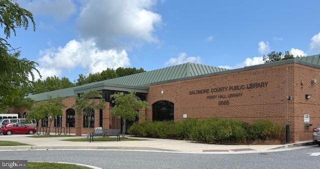 13 Brook Farm Court, Unit 13L Perry Hall, MD 21128 - Photo 30 of 31 a front view of a building with garden