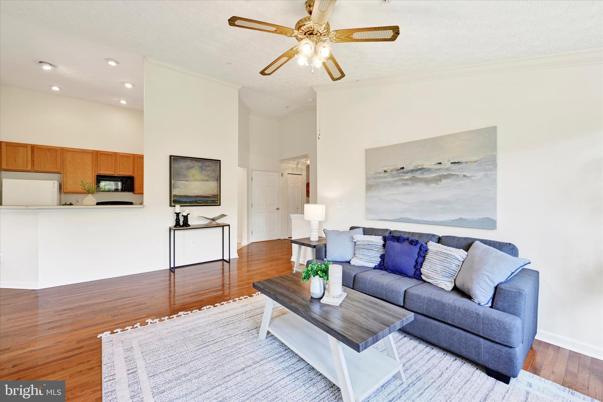 13 Brook Farm Court, Unit 13L Perry Hall, MD 21128 - Photo 6 of 31 a living room with furniture and a flat screen tv