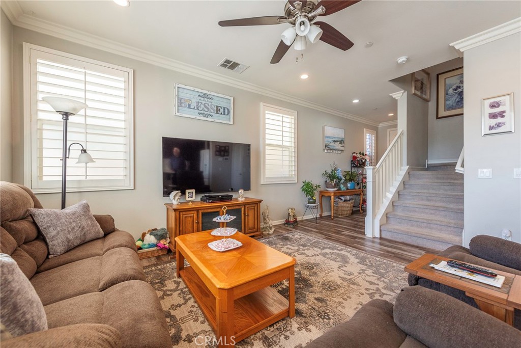 33837 Cansler Way Yucaipa, CA 92399 - Photo 11 of 49 a living room with furniture and a flat screen tv