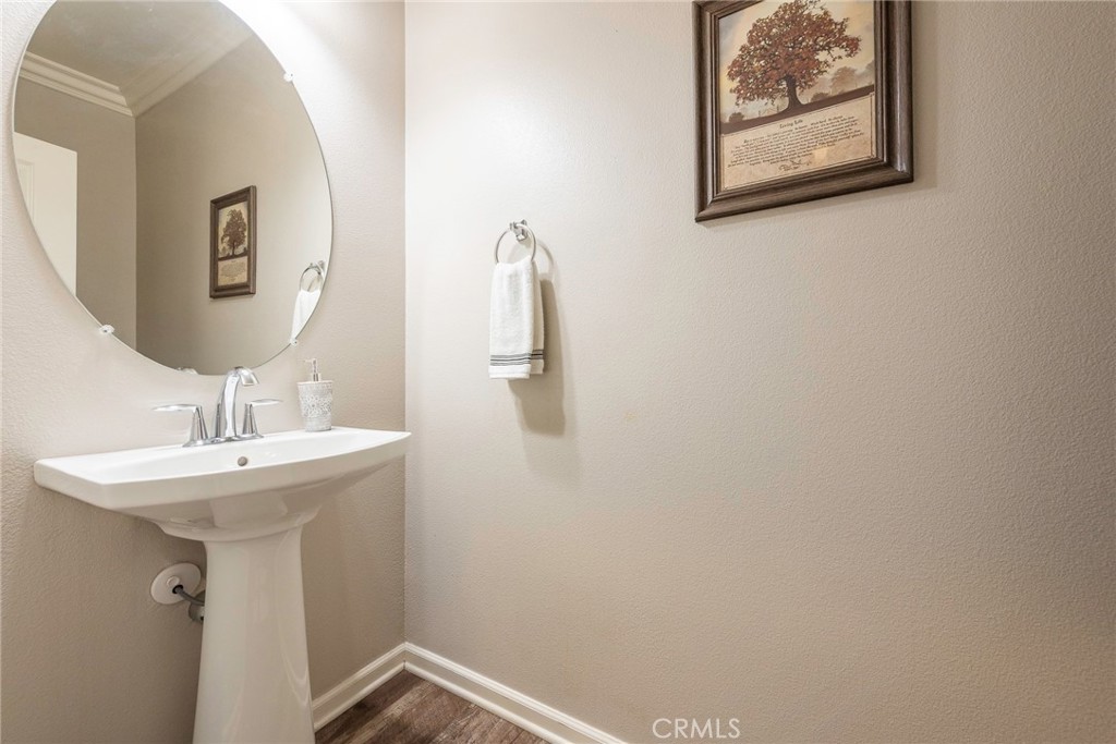 33837 Cansler Way Yucaipa, CA 92399 - Photo 18 of 49 a bathroom with a sink and mirror