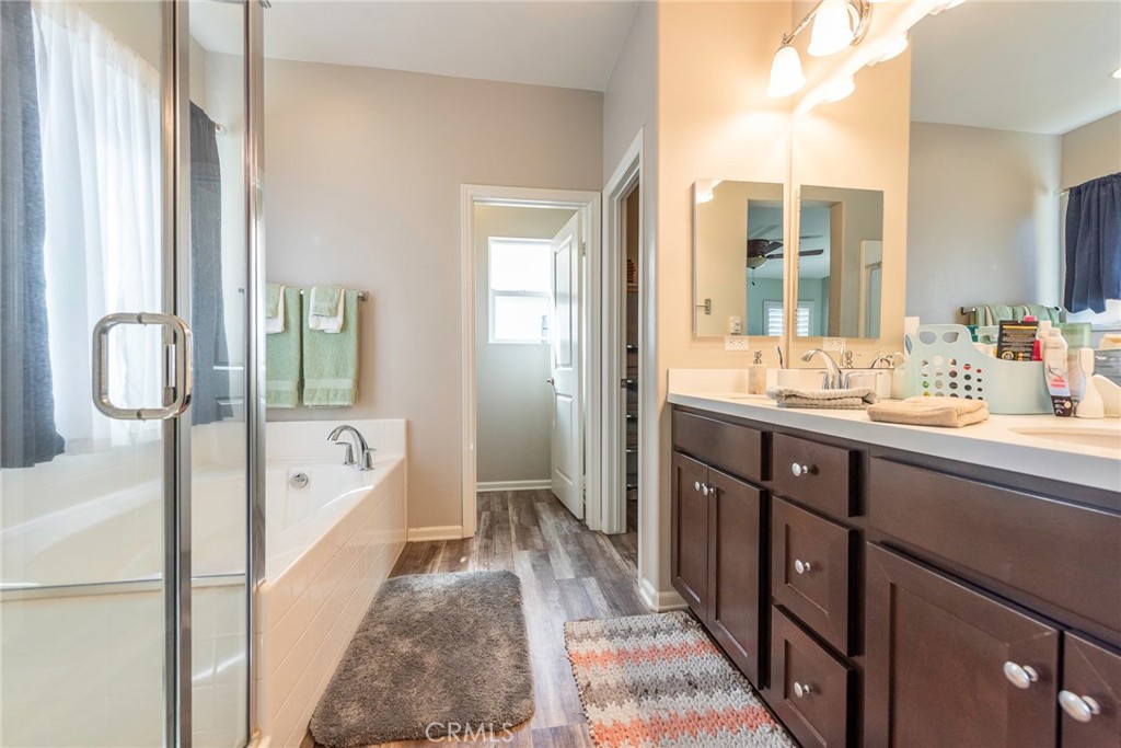 33837 Cansler Way Yucaipa, CA 92399 - Photo 33 of 49 a spacious bathroom with a tub sink shower and mirror