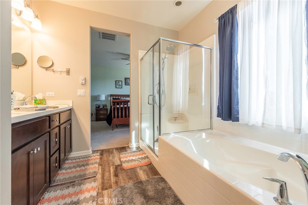 33837 Cansler Way Yucaipa, CA 92399 - Photo 34 of 49 a spacious bathroom with a tub sink and shower