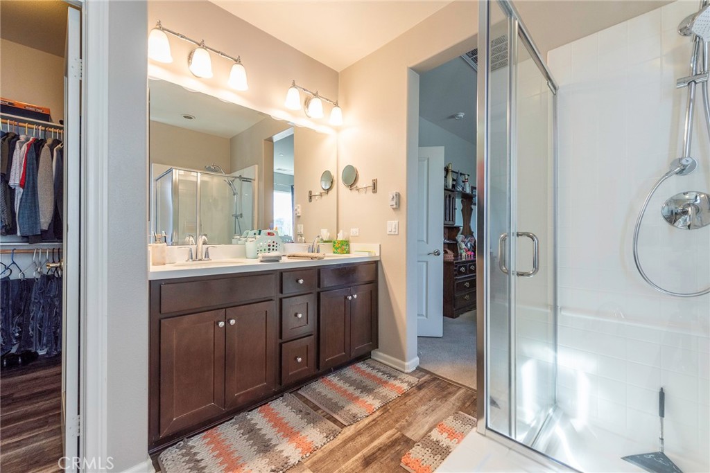 33837 Cansler Way Yucaipa, CA 92399 - Photo 37 of 49 a spacious bathroom with a double vanity sink and a mirror