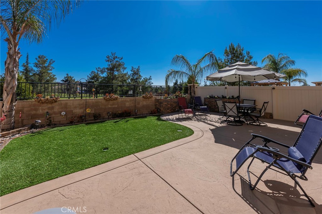 33837 Cansler Way Yucaipa, CA 92399 - Photo 39 of 49 a view of a backyard with sitting area