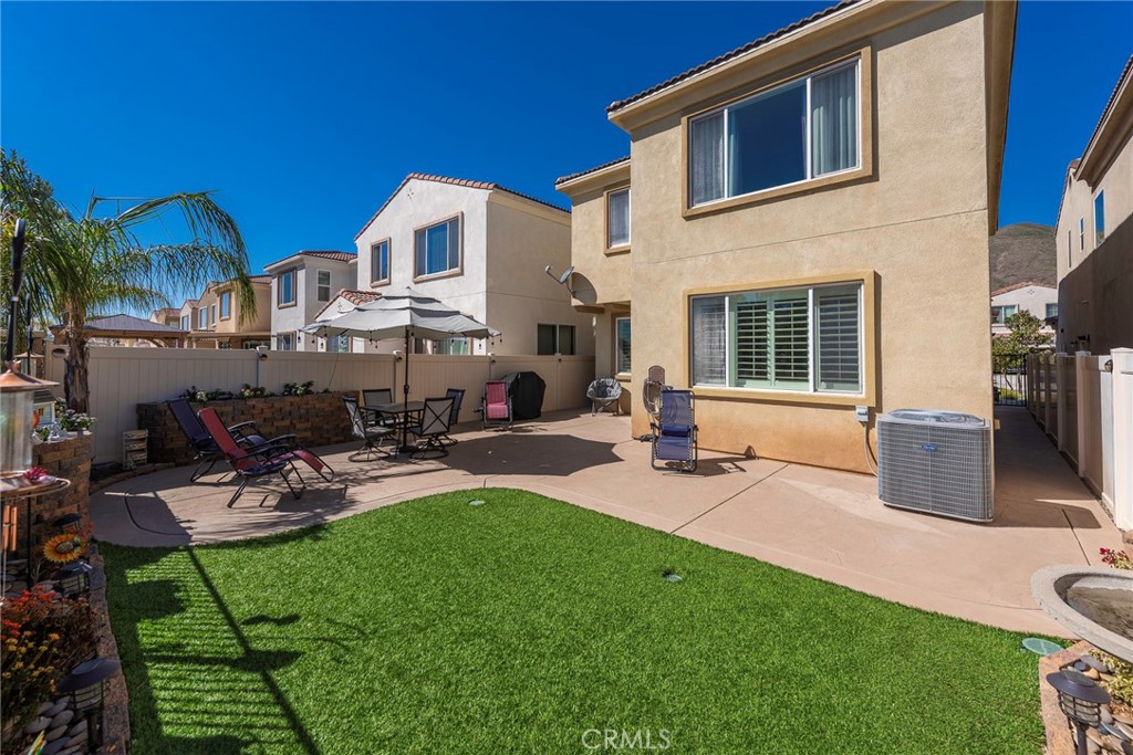 33837 Cansler Way Yucaipa, CA 92399 - Photo 40 of 49 a view of a house with backyard porch and sitting area