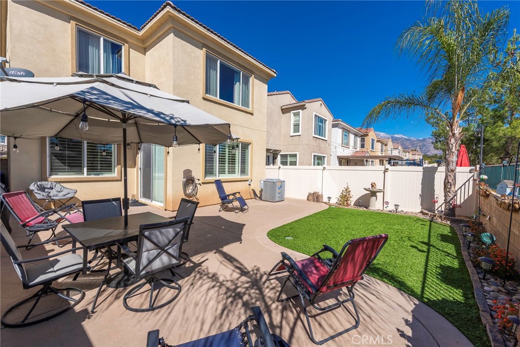 33837 Cansler Way Yucaipa, CA 92399 - Photo 41 of 49 a view of a patio with table and chairs and potted plants