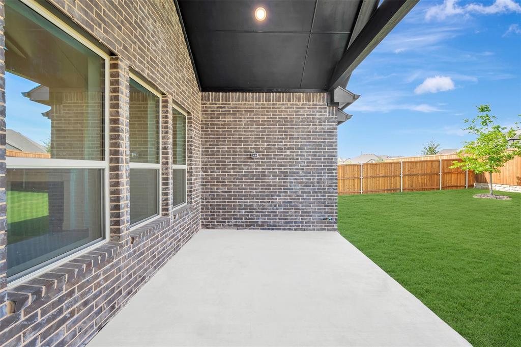 11460 Wulstone Road Fort Worth, TX 76052 - Photo 35 of 40 a view of backyard with garden