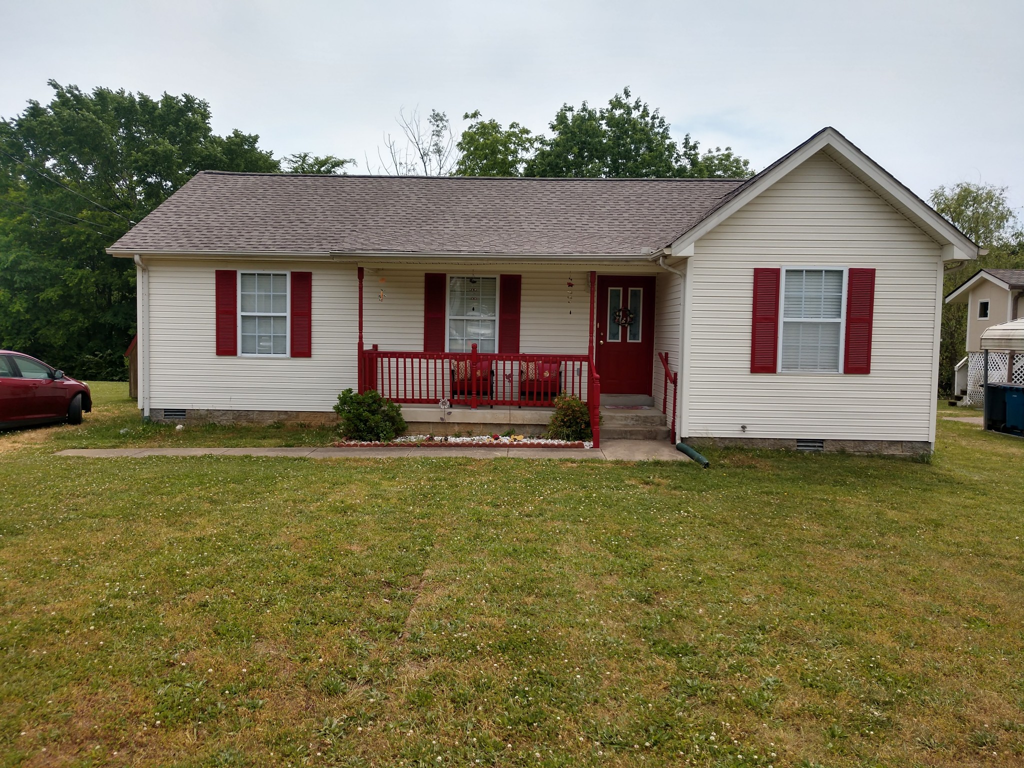 a front view of a house with garden