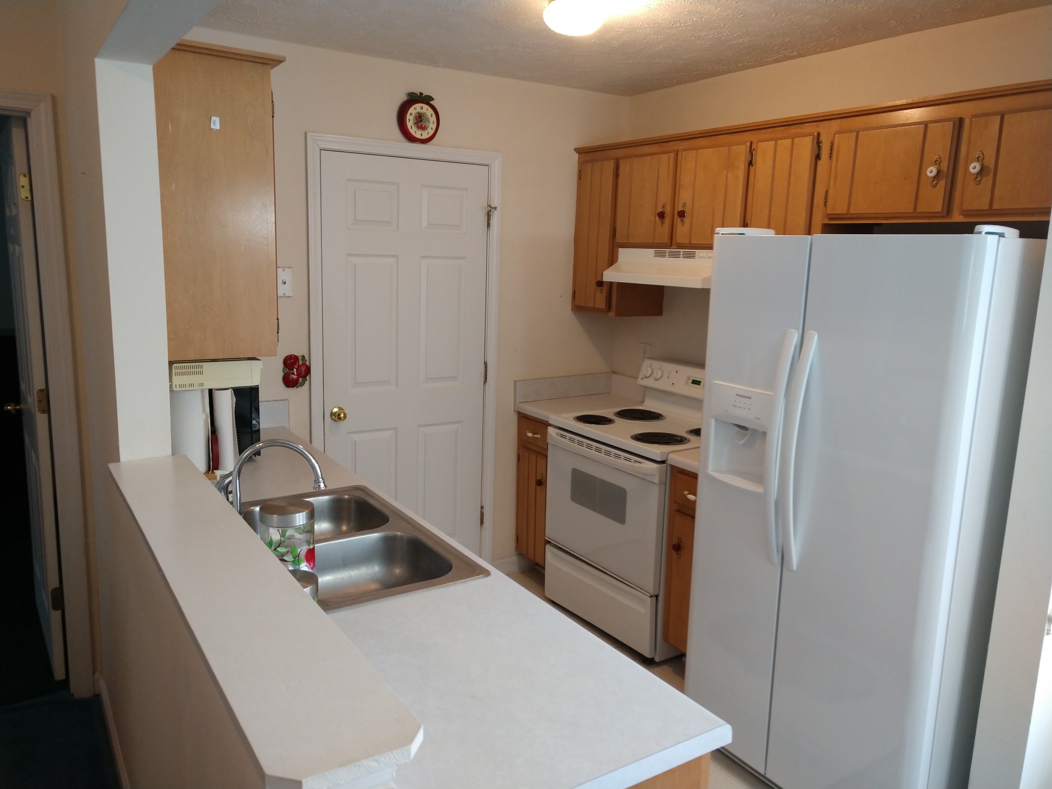 1511 Ridgemont Drive La Vergne, TN 37086 - Photo 12 of 18 a kitchen with a white stove and refrigerator