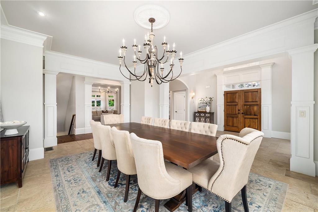13200 Owens Way Milton, GA 30004 - Photo 13 of 113 a view of a dining room with furniture wooden floor and chandelier
