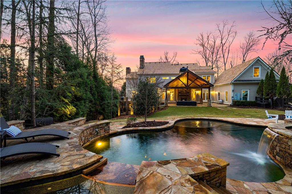 13200 Owens Way Milton, GA 30004 - Photo 25 of 113 a view of a house with swimming pool and sitting area