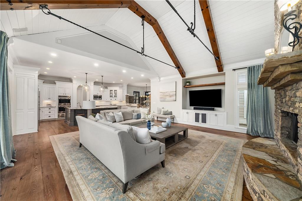 13200 Owens Way Milton, GA 30004 - Photo 27 of 113 a living room with furniture and a flat screen tv