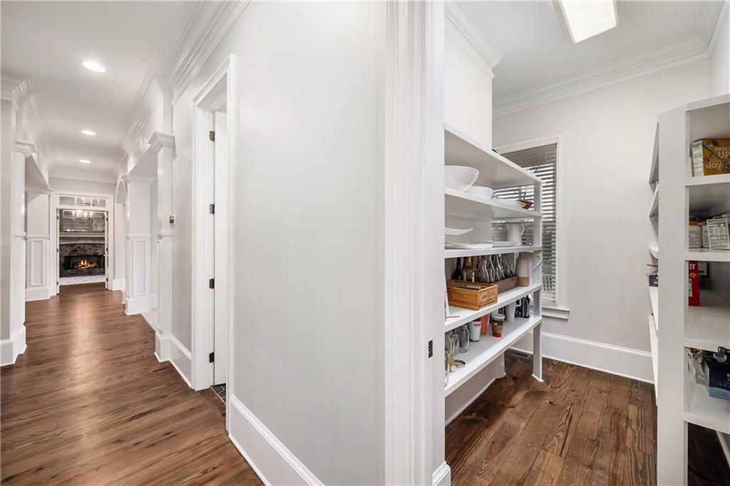 13200 Owens Way Milton, GA 30004 - Photo 35 of 113 a view of hallway with wooden floor and stairs