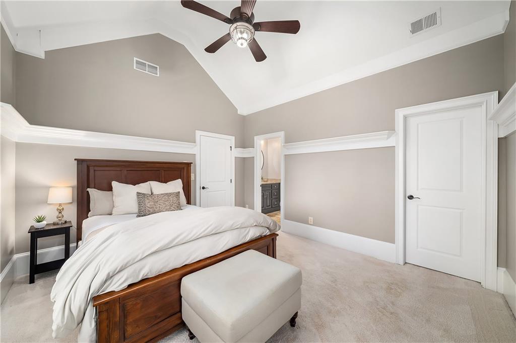 13200 Owens Way Milton, GA 30004 - Photo 59 of 113 a bedroom with a bed and a lamp