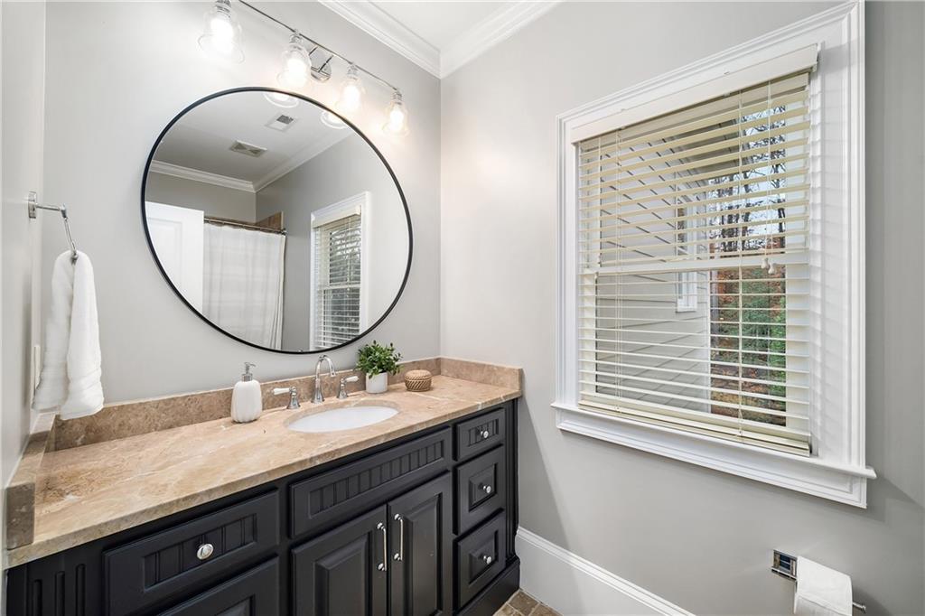 13200 Owens Way Milton, GA 30004 - Photo 60 of 113 a bathroom with a sink and a mirror