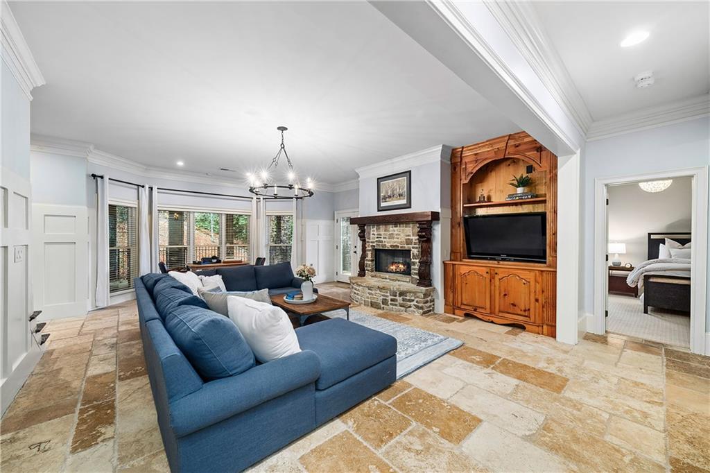 13200 Owens Way Milton, GA 30004 - Photo 61 of 113 a living room with furniture flat screen tv and a fireplace