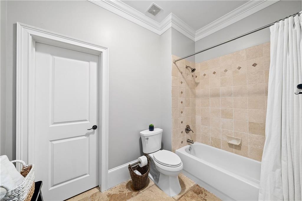 13200 Owens Way Milton, GA 30004 - Photo 66 of 113 a bathroom with a toilet and a bathtub