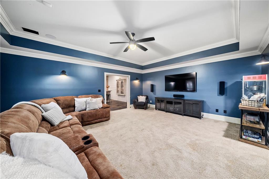 13200 Owens Way Milton, GA 30004 - Photo 72 of 113 a living room with furniture and a flat screen tv