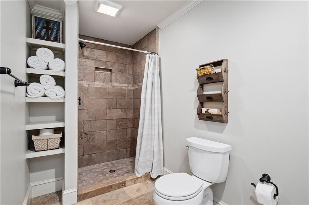 13200 Owens Way Milton, GA 30004 - Photo 75 of 113 a white toilet sitting next to a bathroom shower