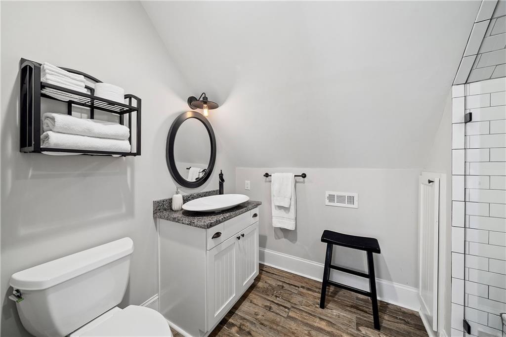 13200 Owens Way Milton, GA 30004 - Photo 81 of 113 a bathroom with a toilet a sink and a mirror