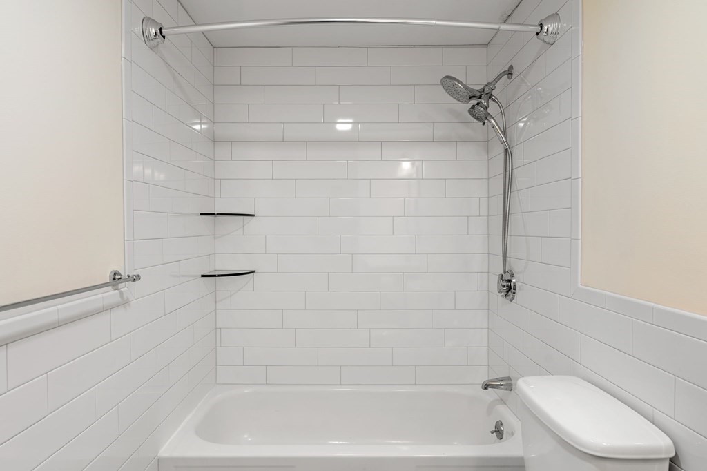 159 Franklin Street, Unit D2 Stoneham, MA 02180 - Photo 17 of 27 a bathroom with a shower and a toilet