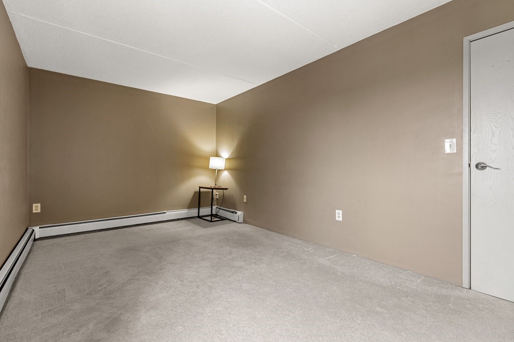 159 Franklin Street, Unit D2 Stoneham, MA 02180 - Photo 22 of 27 an empty room with a workbench