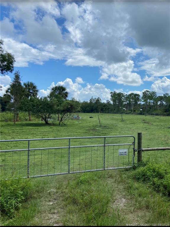 5608 Southwest Cherokee Street Palm City, FL 34990 - Photo 2 of 4 a view of a golf course with a lake