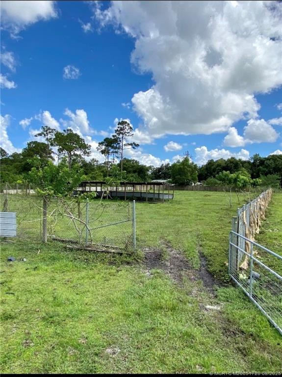 5608 Southwest Cherokee Street Palm City, FL 34990 - Photo 4 of 4 a view of a golf course with a lake
