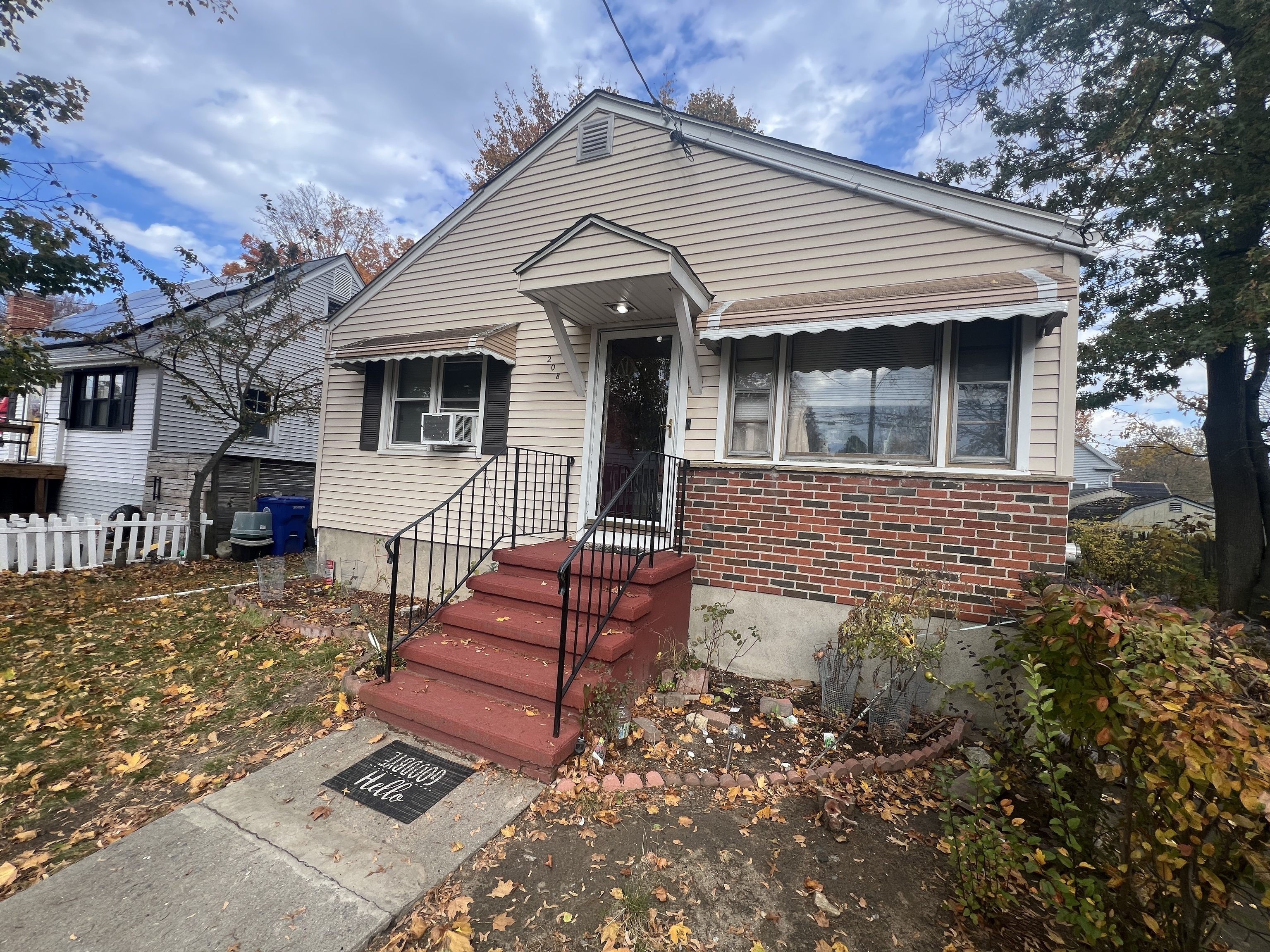 a front view of a house with stairs