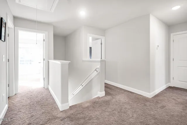 a kitchen with sink and refrigerator