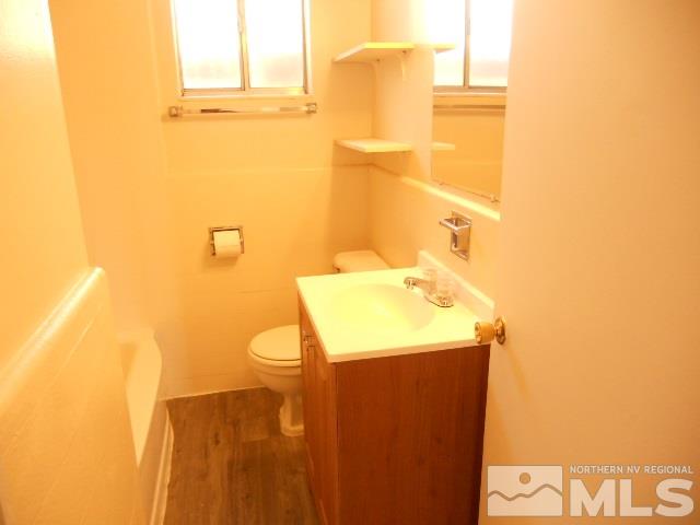 20 Volmer Way Reno, NV 89512 - Photo 11 of 24 a bathroom with a sink and mirror