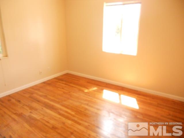 20 Volmer Way Reno, NV 89512 - Photo 14 of 24 a view of empty room with wooden floor