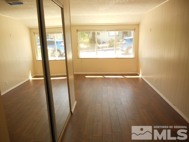20 Volmer Way Reno, NV 89512 - Photo 10 of 24 an empty room with wooden floor and windows