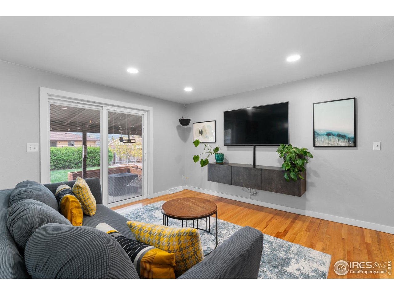 9261 Julian Way Westminster, CO 80031 - Photo 11 of 33 a living room with furniture and a flat screen tv