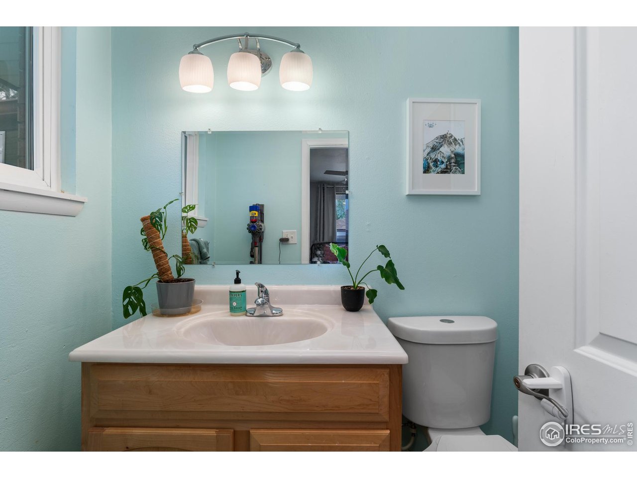 9261 Julian Way Westminster, CO 80031 - Photo 16 of 33 a bathroom with a sink and a mirror with toilet
