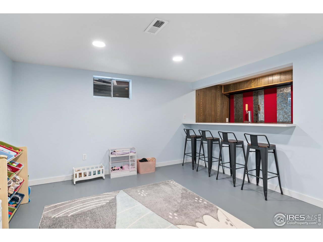 9261 Julian Way Westminster, CO 80031 - Photo 21 of 33 a living room with furniture and a flat screen tv
