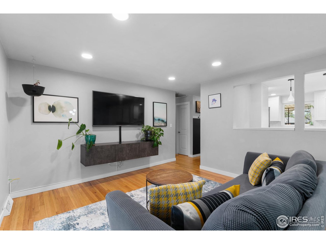 9261 Julian Way Westminster, CO 80031 - Photo 10 of 33 a living room with furniture and a flat screen tv