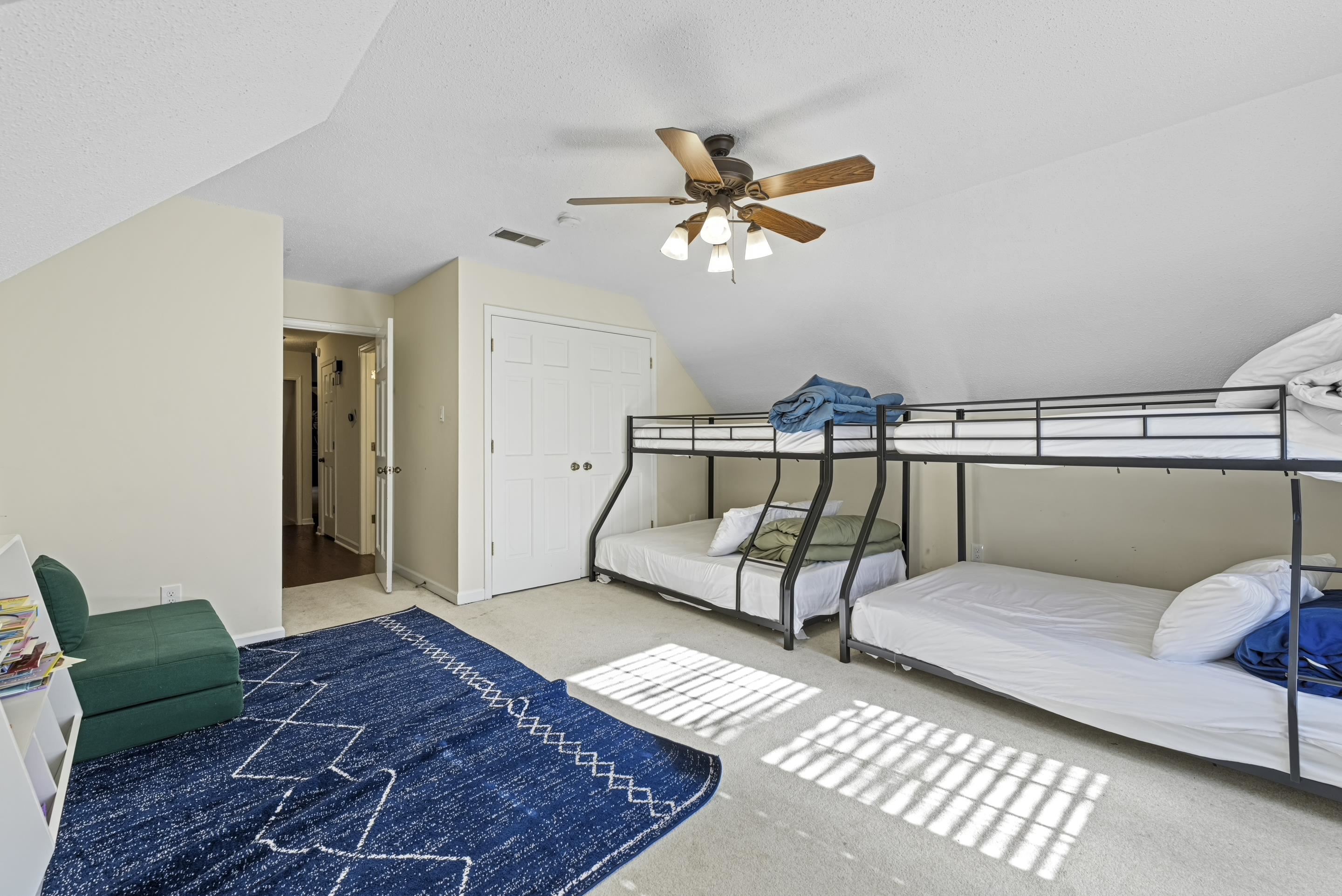 1316 Kirby Road Memphis, TN 38120 - Photo 16 of 30 a bedroom with a bed and a chandelier