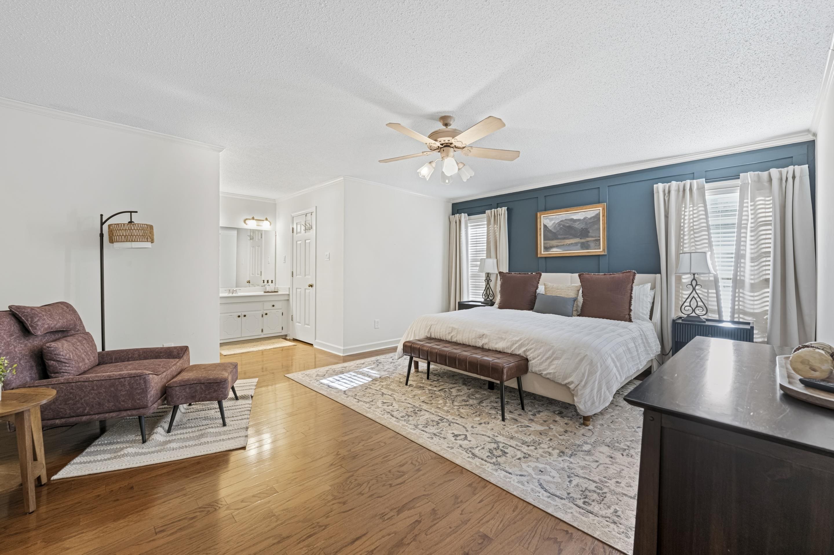 1316 Kirby Road Memphis, TN 38120 - Photo 24 of 30 a spacious bedroom with a bed a window and a chandelier