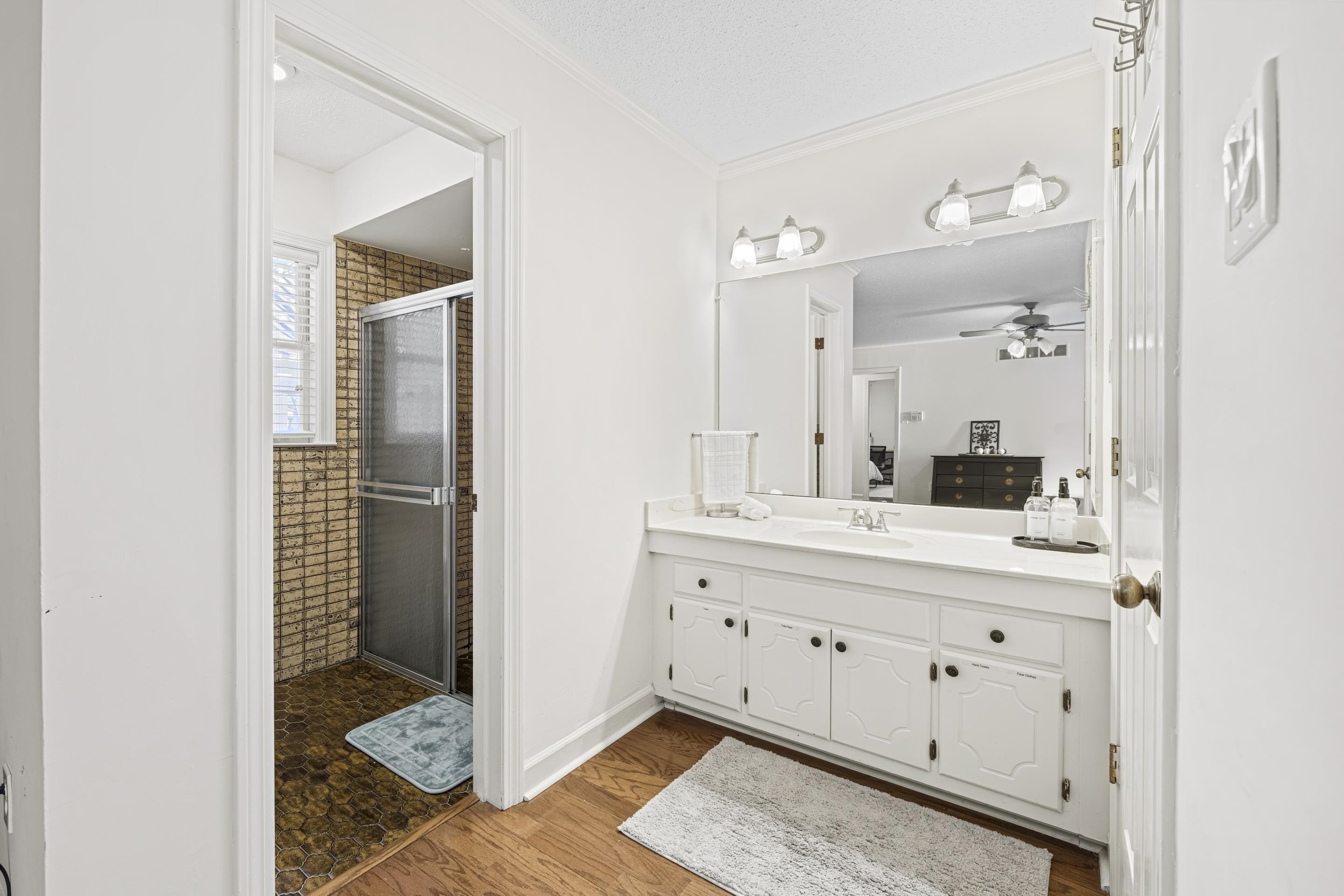 1316 Kirby Road Memphis, TN 38120 - Photo 25 of 30 a bathroom with a double vanity sink and mirror