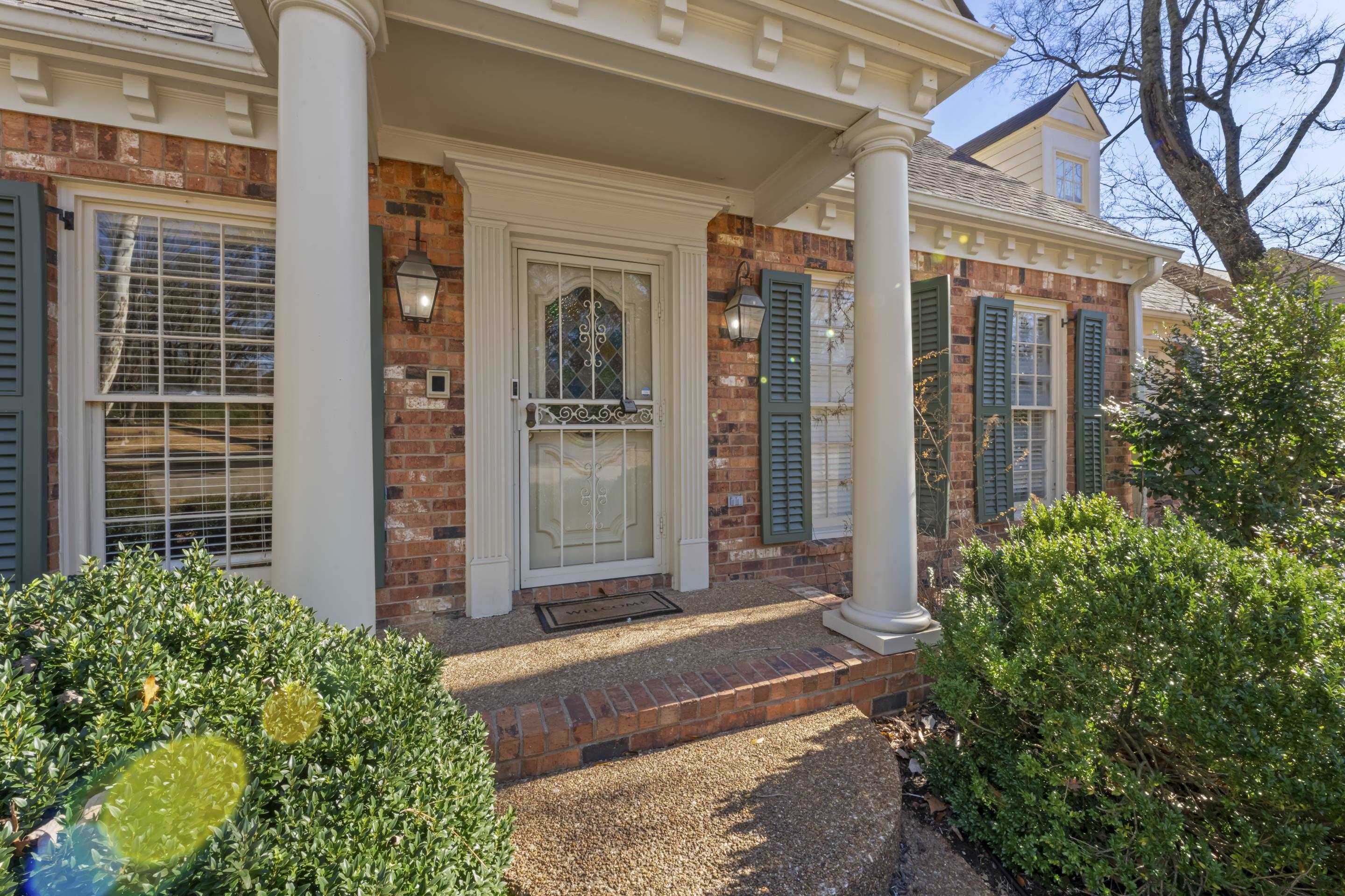 1316 Kirby Road Memphis, TN 38120 - Photo 5 of 30 a front view of a house with a garden