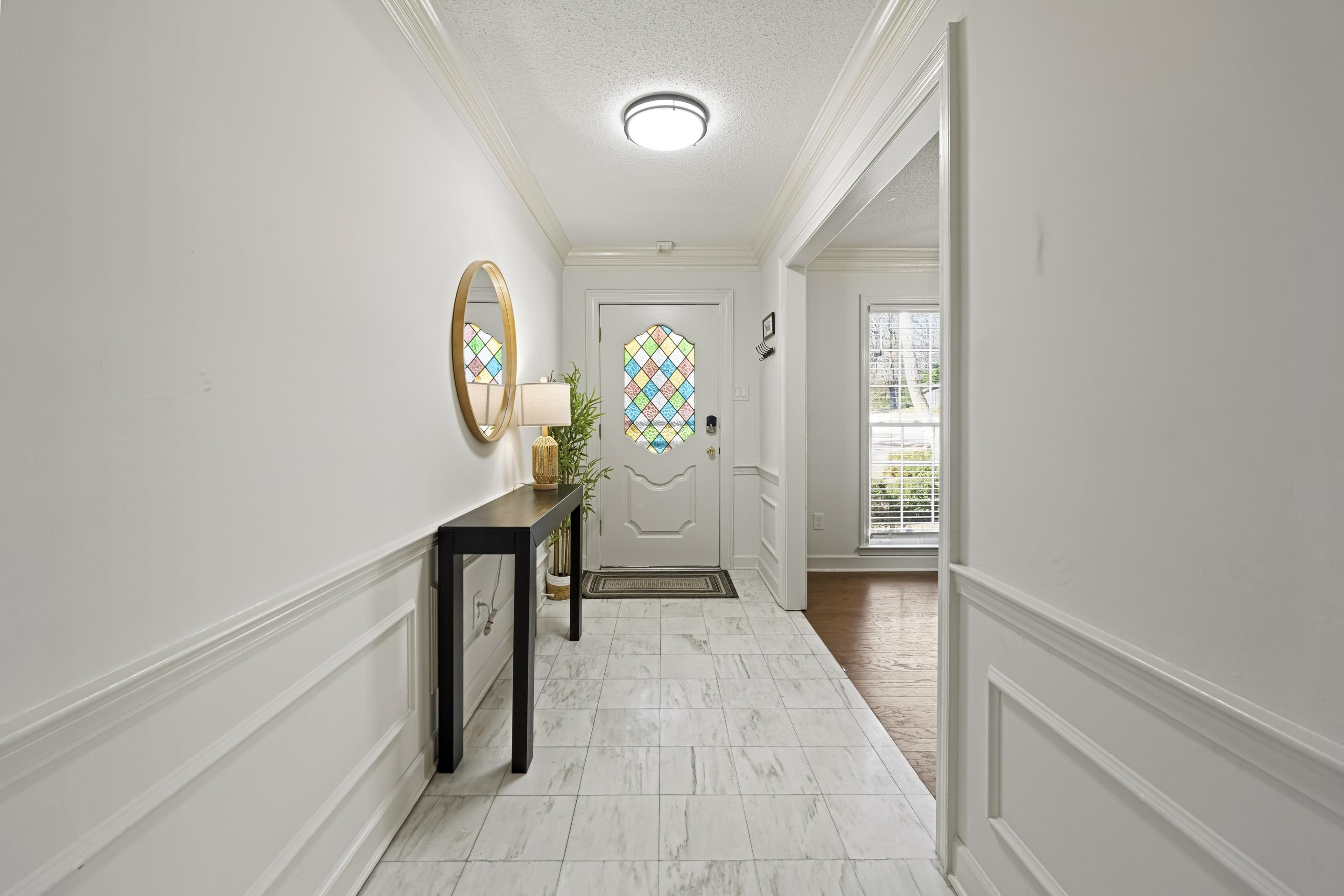 1316 Kirby Road Memphis, TN 38120 - Photo 6 of 30 a view of a hallway to a livingroom with furniture
