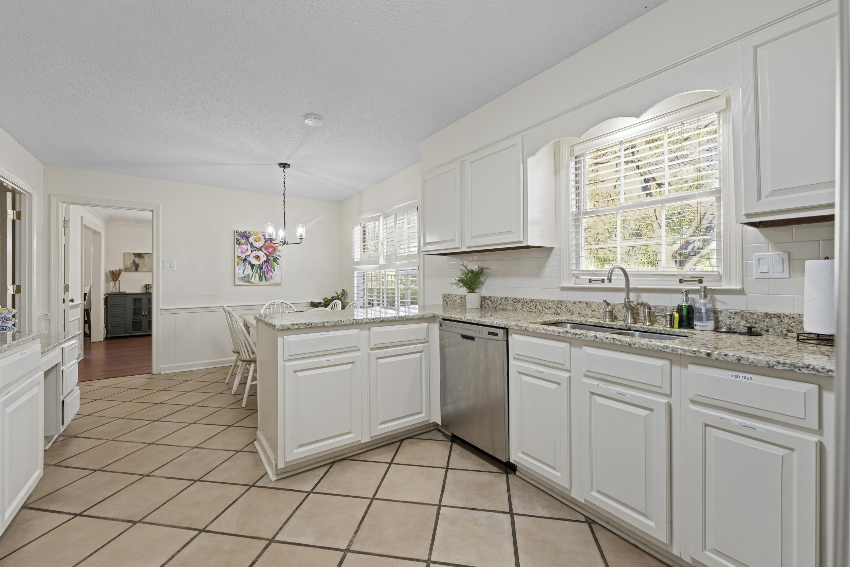 1316 Kirby Road Memphis, TN 38120 - Photo 8 of 30 a kitchen with cabinets and window
