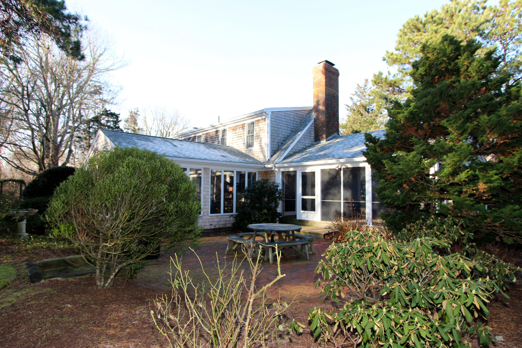 10 Highland Road Eastham, MA 02642 - Photo 23 of 31 a view of a patio with table and chairs and potted plants