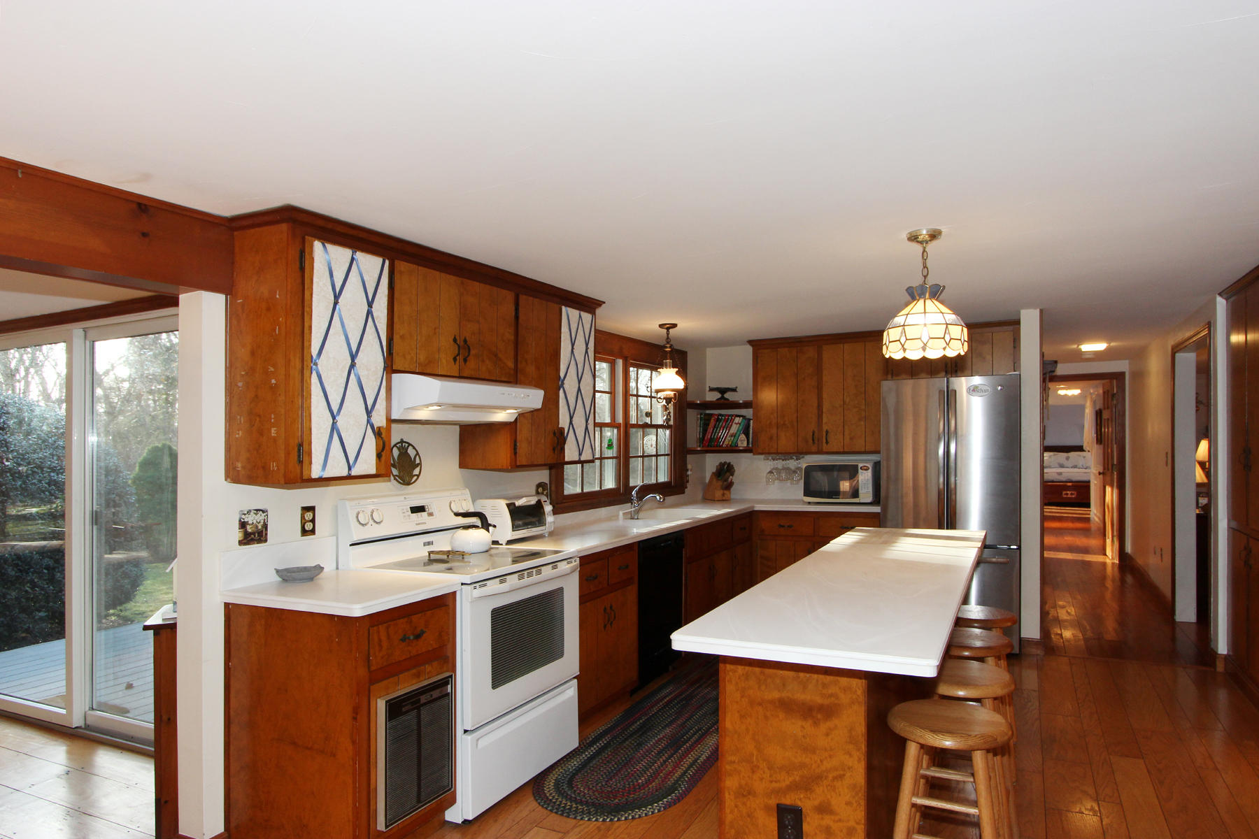 10 Highland Road Eastham, MA 02642 - Photo 3 of 31 a kitchen with stainless steel appliances kitchen island a large island in the center