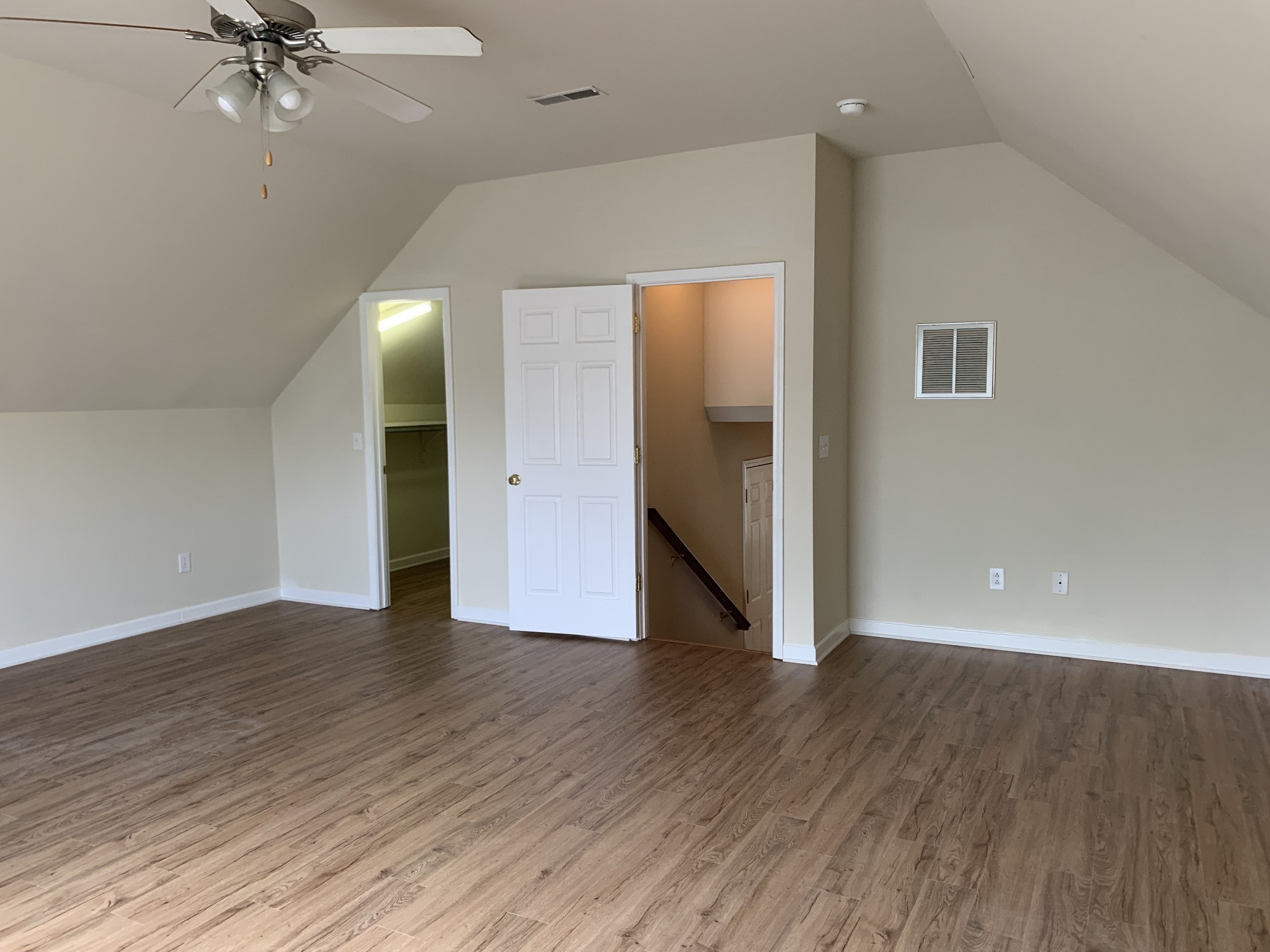 1036 Persimmon Drive Spring Hill, TN 37174 - Photo 12 of 12 an empty room with wooden floor fan and windows