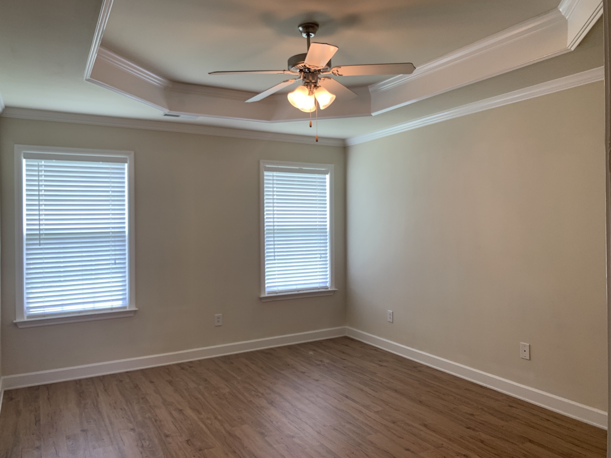 1036 Persimmon Drive Spring Hill, TN 37174 - Photo 6 of 12 a view of an empty room with wooden floor and a window