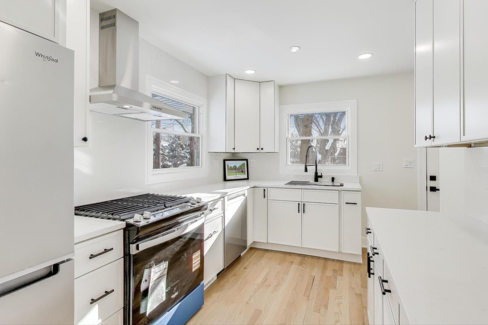 623 North Benton Street Palatine, IL 60067 - Photo 2 of 27 a kitchen with granite countertop a sink stove and cabinets